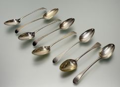 A collection of eight George III London silver old English pattern table spoons to include one by