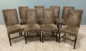 A set of eight Edwardian oak-framed dining chairs, with contemporary brown polka dot upholstery to
