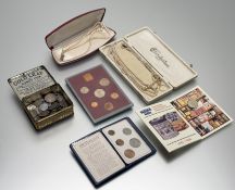 A tin box containg a colelction of silver and white metal British Equropean, Middle Eastern and