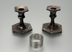 A pair of Edward VII Birmingham silver unweighted low candlesticks of octagonal outswept form: h.