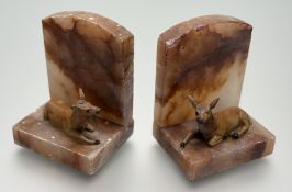 A pair of Art Deco alabaster bookends with cold painted lying down deer figures to base (h-12cm) (