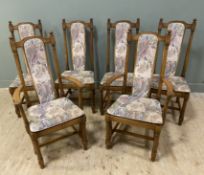 A set of 6 mid-century oak dining chairs by Ercol, four plus two, with arched tops and column backs,