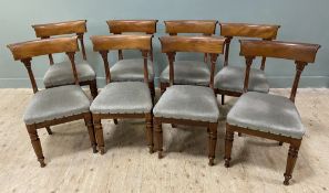 A set of eight George IV mahogany dining chairs, curved tablet back-rests raised on neo-classical