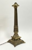 A late 20thC brass Corinthian column table lamp in the Neoclassical style, featuring a fluted column
