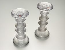 A pair of Finnish art glass candlesticks of four rings designed by Timo Sarpaneva for Littala,