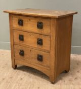 A late 19th/ early 20th century Arts and Crafts pine chest of drawers, fitted with three long