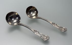 A pair of late Victorian London silver double-struck Kings pattern sauce ladles: l. x 16.2cm