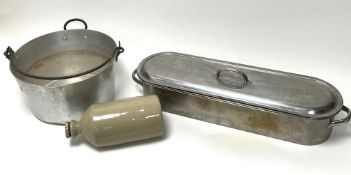 An early 20thc salt-glazed stoneware hot water bottle (l. 29cm), together with a stainless steel
