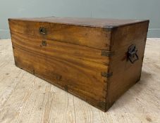 An early 20th century camphor chest, brass mounted corners and handles, lifting to reveal storage to