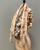 A collection of early/mid 20thC furs comrpising a double sided mink fur stole in light tan, a grey