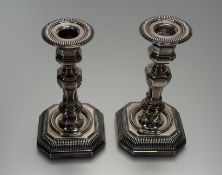 A pair of Italian 800 standard white metal octagonal baluster table candlesticks with fluted