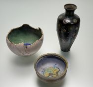 A textured cracked eggshell shaped bowl with inner mottled green glaze and blue cracked glass effect