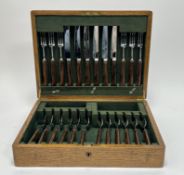A 1920s oak canteen converted to hold a set of Cristtopher Johnson of Sheffield stainless steel