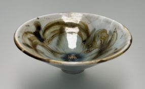A Studio Pottery footed pedestal porcelain bowl, deipciting fish in a brown glaze highlighted with
