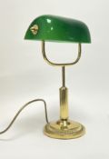 A contemporary 1920s style gold metal and green glass bankers table lamp with adjustable shade,