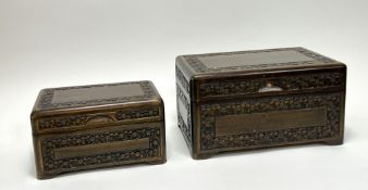 A hand-carved wooden box with floral decoration and hinged top revealing a blue velvet interior (