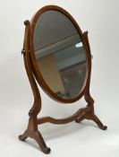 An Edwardian oval swing dressing table mirror (h. 60cm)