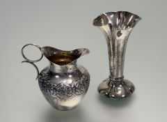 A late Victorian London silver weighted fluted bud vase of flared form on leaf style base: h. x