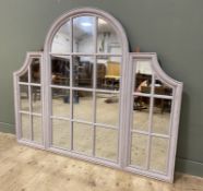 A contemporary wall mirror, in the form of a Venetian window, arched top with window pane-style