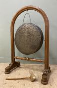 A Victorian oak framed dinner gong, of country house proportions, arched frame with beaten bronze