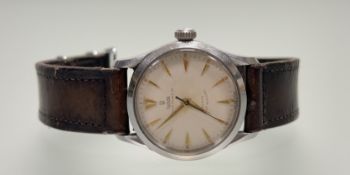 A Vintage Tudor Oyster Prince 34 rotar self winding stainless steel wristwatch with champagne dial