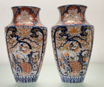 A pair of Japanese blue and white Imair ribbed ovoid form vases with flowering chrysanthemum and