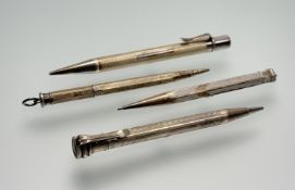 A collection of four silver propelling pencils to include an Eversharp and box: l. x 10cm, a Lady