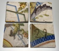 A set of four English Delftware 18thc tin-glazed tiles, two with later added black painted numbers -