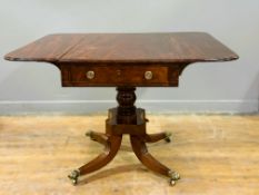 An early 19thc mahogany sofa table with ebony strung border, fitted single end frieze drawer, on