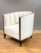 An Art Deco style club chair with deeply quilted interior, grey ash frame, in textured cream