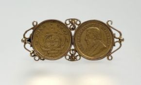 Two South African half pond gold coins, 1896 and 1897, mounted together as a brooch in unmarked