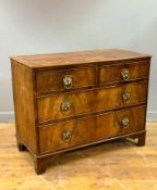 A 19thc ebony strung mahogany chest fitted with two short and two long drawers, on bracket feet with