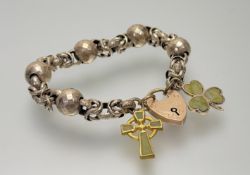 A Victorian yellow metal chain link bracelet made up of circualr plain and engraved links and