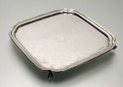 A George VI silver salver, Viner's, Sheffield 1939, of shaped square form, on four scroll feet (