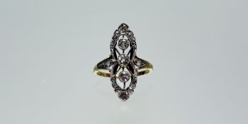 An Edwardian white and yellow metal three stone old cut diamond ring each stone approximately 0.15ct