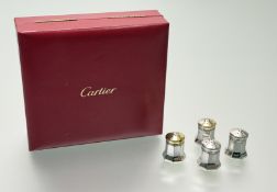A cased set of four Cartier sterling silver pepperettes, each with screw fitting pierced domed