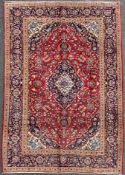 A finely knotted Persian Kashan carpet, central medallion surrounded by all-over scrolling