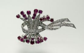 An 18ct white gold spray brooch set brilliant-cut diamonds in milegrain setting and round facet