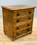 A 19thc burr walnut miniature table chest, fitted four long drawers on plinth base and bun feet with
