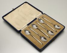 A cased set of George V enamelled silver coffee spoons, Turner & Simpson, Birmingham, 1932, the