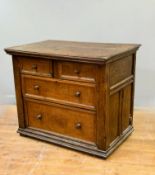 A good plain late 17thc/early 18thc oak plank top chest with coffer fronted drawers and sides, on