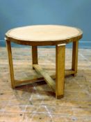 An Art Deco satinwood and bleached burr walnut lamp table, raised on square supports with scroll