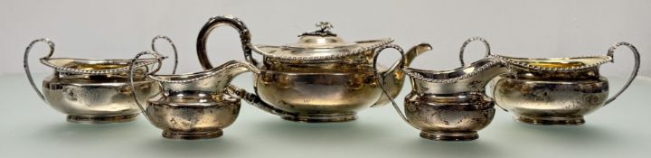 A George IV silver five piece tea service, Smith Tate & Co., Sheffield 1823 and 1827, comprising a