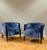 A pair of walnut framed low club chairs upholstered in blue velvet (h.60cm x l.65cm x w.63cm)