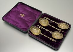 A cased set of four Victorian silver-gilt serving spoons, Elkington & Co., Birmingham 1877, each