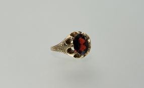 A 9ct gold ring set oval faceted garnet approximately 2ct J/K 6.65g
