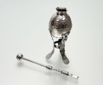 A Latin American white metal mate cup, of gourd form, with repousse decoration, on three legs