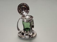 An Edwardian Arts & Crafts silver and glass inkwell, Martin Hall & Co., Sheffield 1903, the shaped