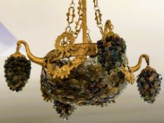 A reproduction French cast brass basket light fitting, with four outer lights all with hanging glass