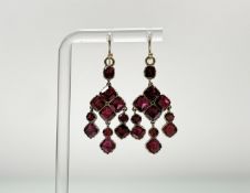 A pair of 19th century yellow metal foil-backed pink garnet chandelier style earrings with three